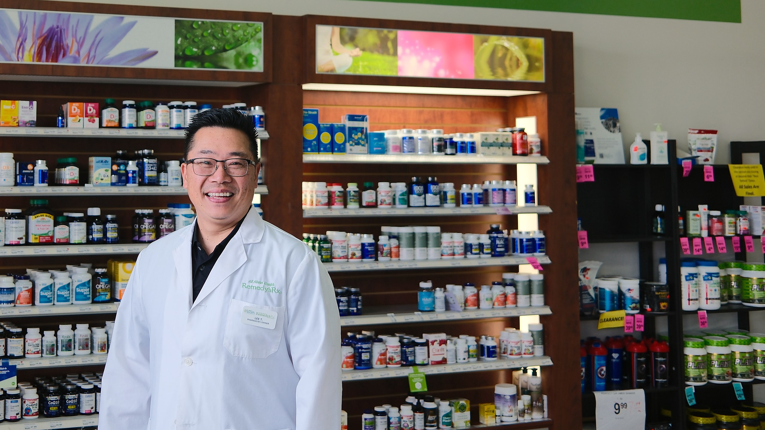Lee Tuan, pharmacist and owner, in the supplement aisle at All About Health Remedy'sRx